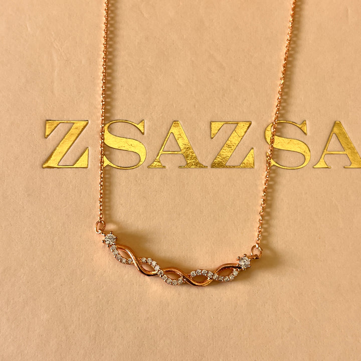 zircone rose gold plated twisted pendant