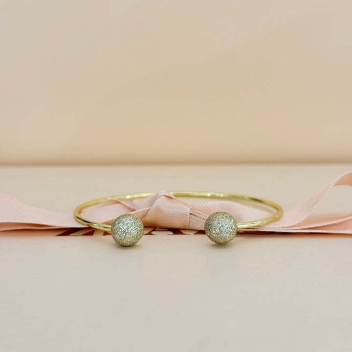 Zircone half ball gold plated bangle