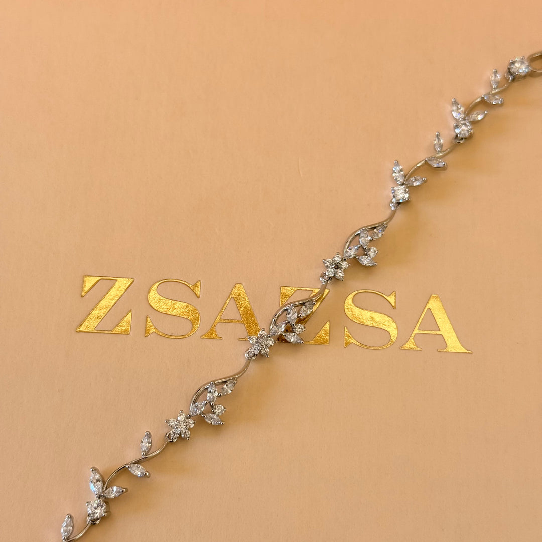 Teardrop and flower zircone silver earrings and bracelet