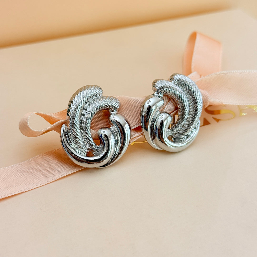 Plain twisted silver clip on earrings