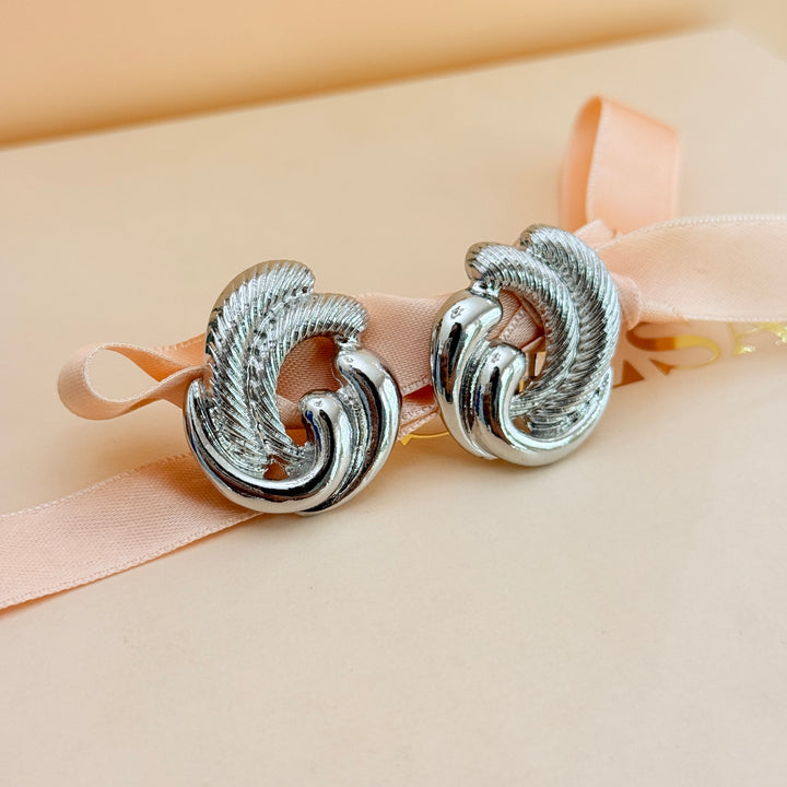 Plain twisted silver clip on earrings