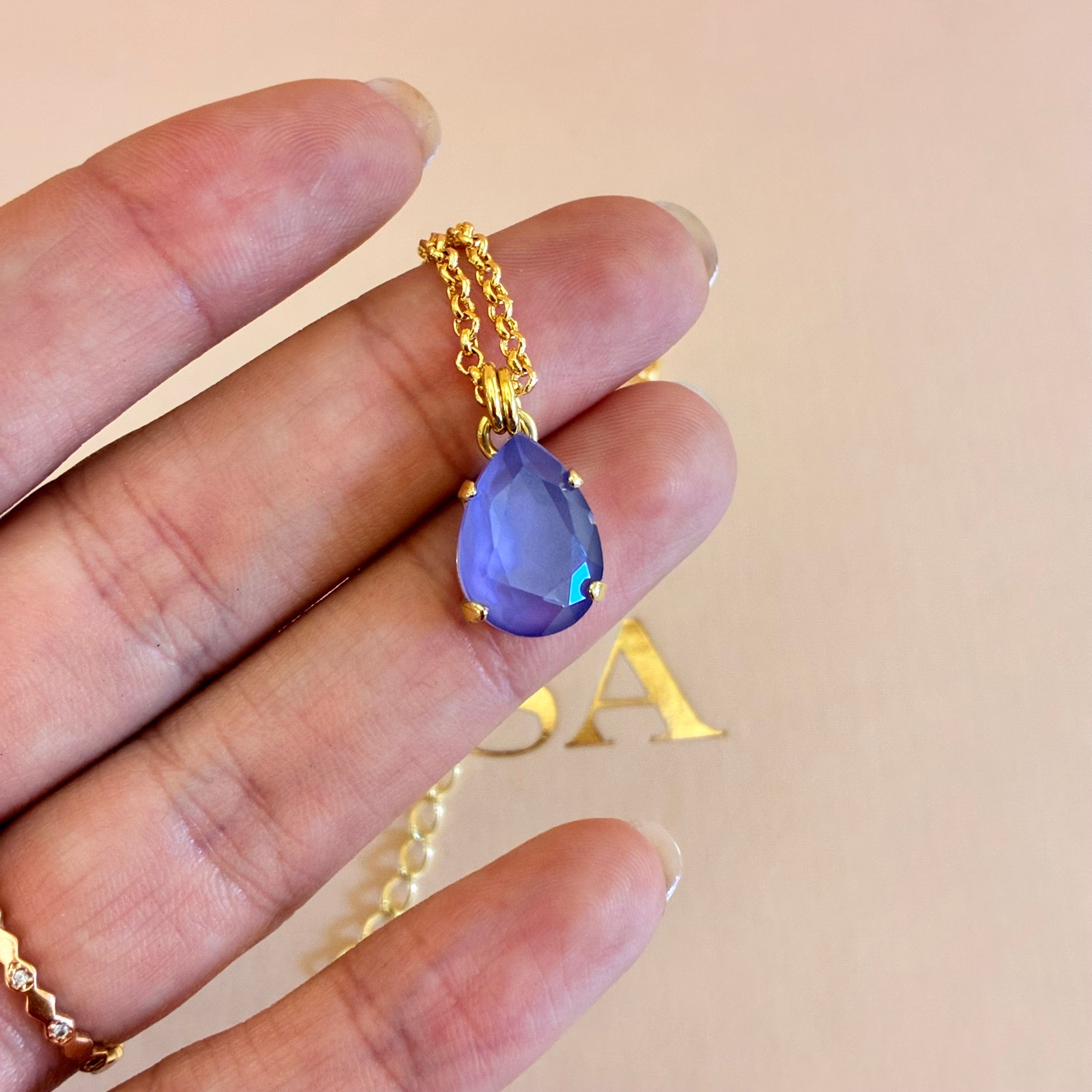 Mix of shapes lilac Swarovski crystals gold plated set