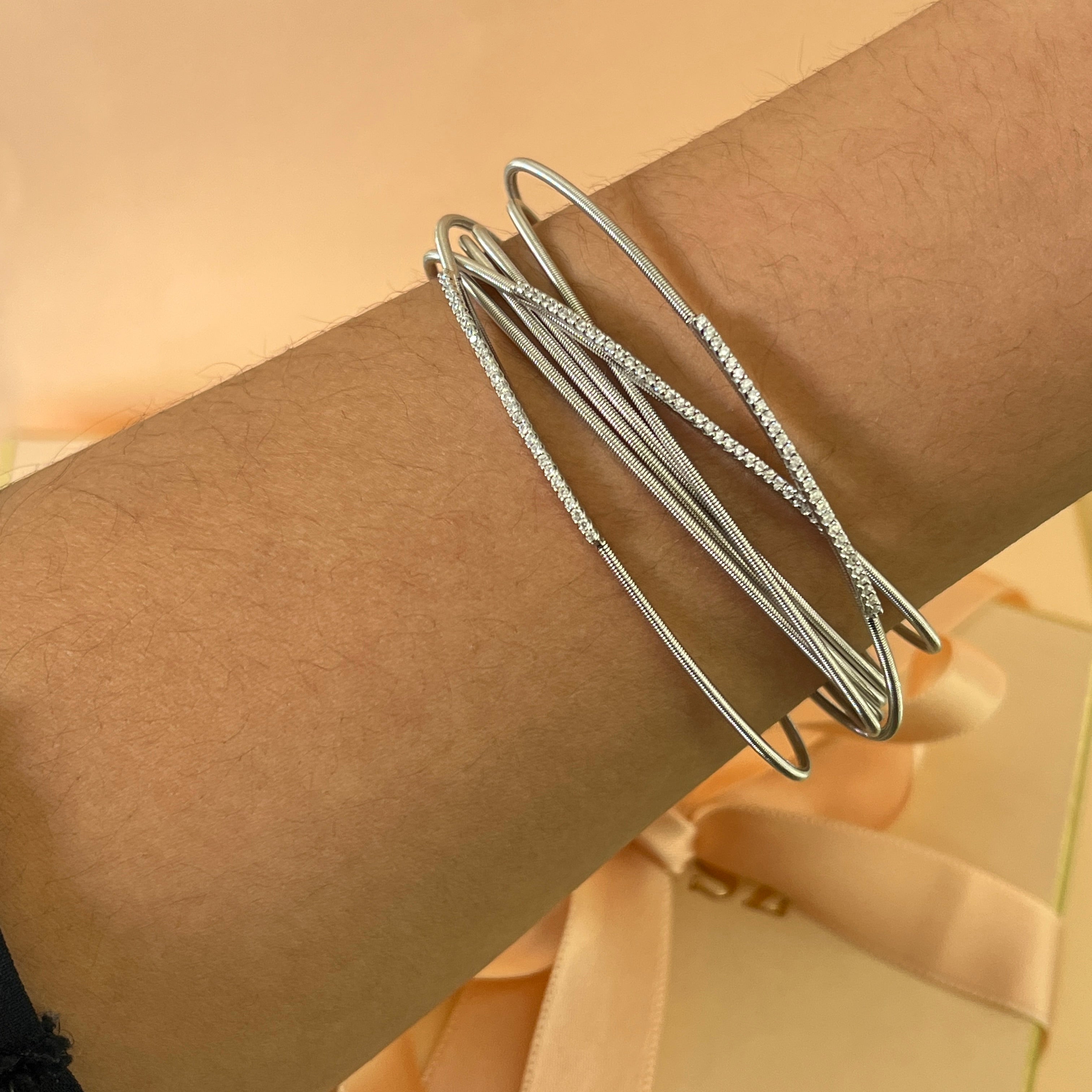 Crossed silver zircone bangle