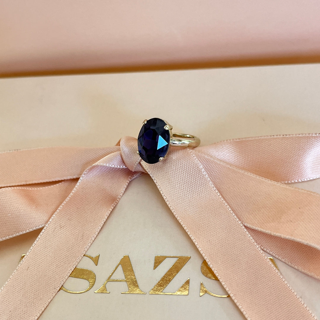 Dark purple oval preciosa crystals ring