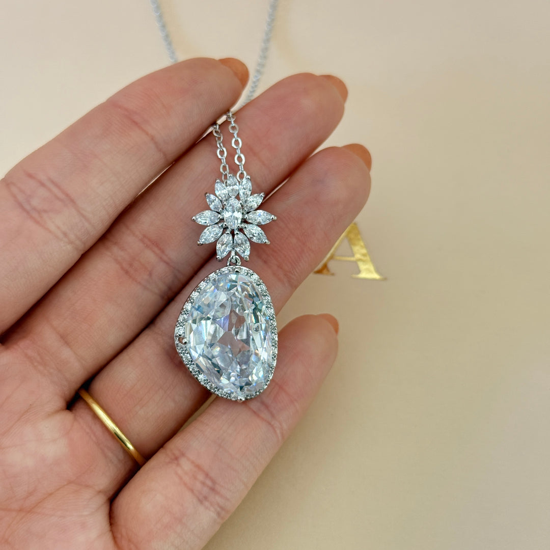 Asymmetric zircone silver pendant