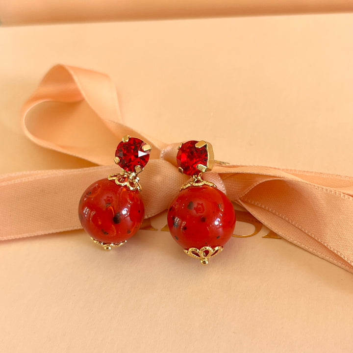Red simple crystals and resin studs