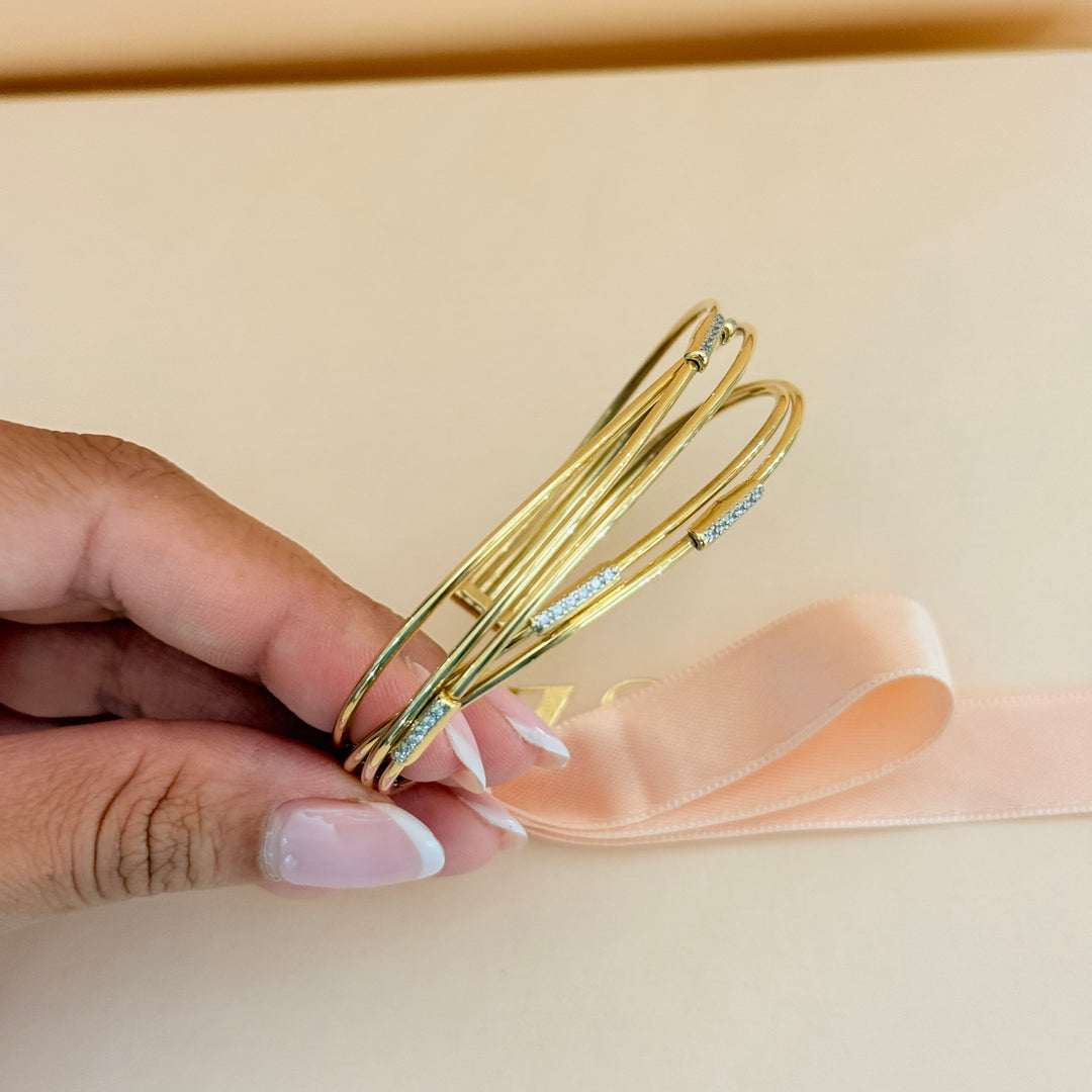 Zircone crossed gold plated sterling silver bangle