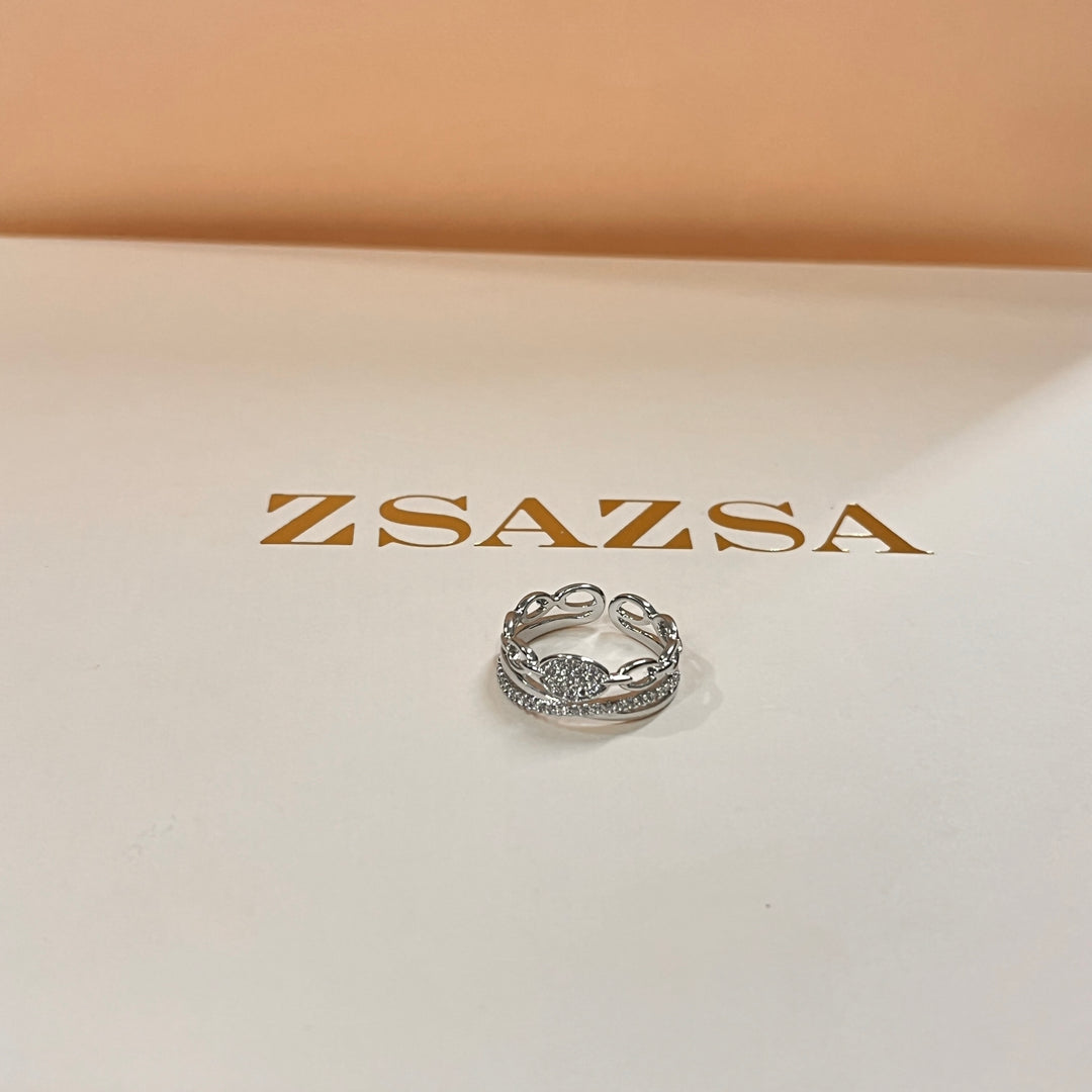 Zircone white gold plated twisted and crossed band ring