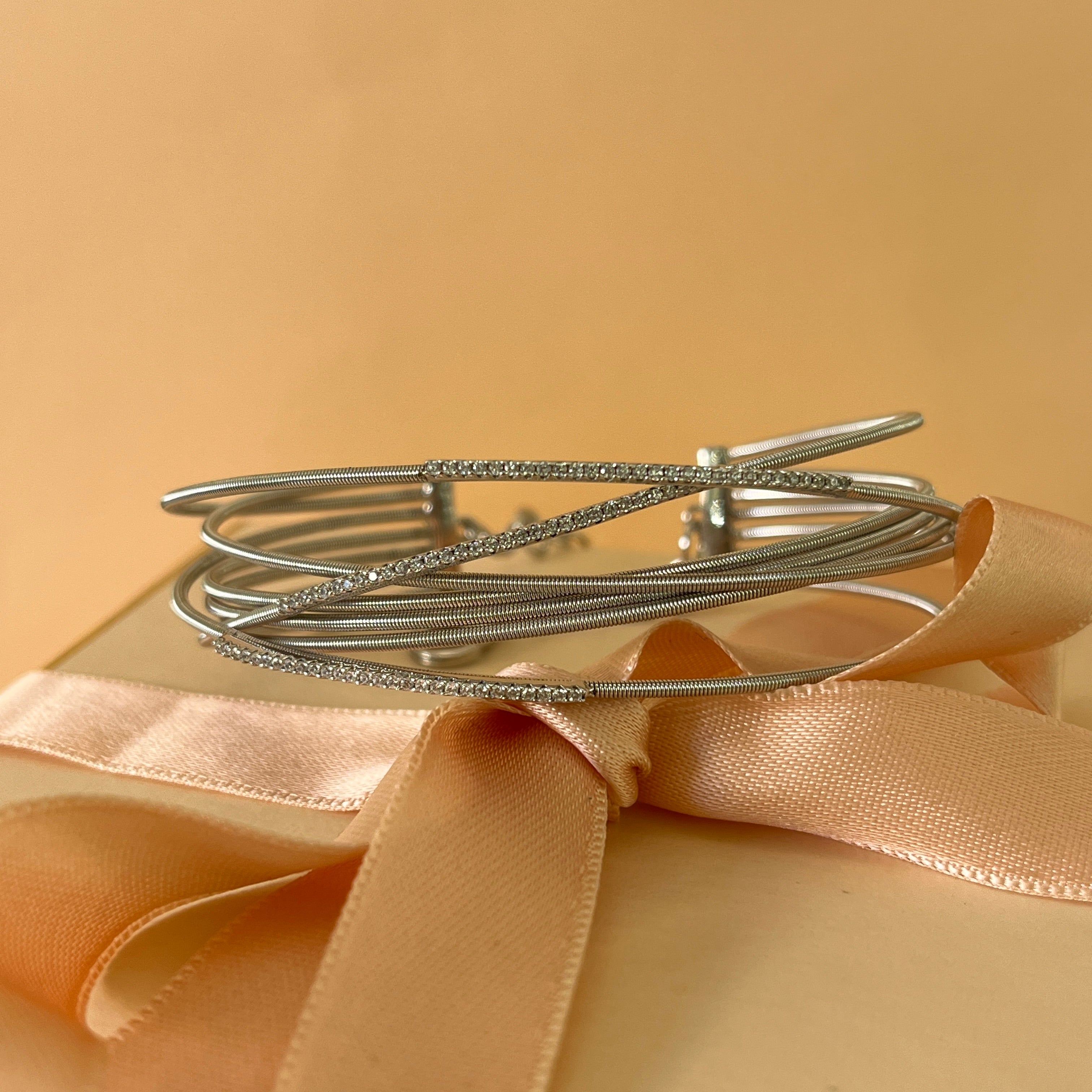 Crossed silver zircone bangle