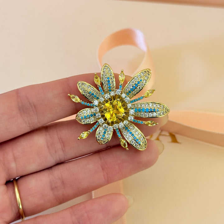 Yellow and turquoise zircone gold plated brooch