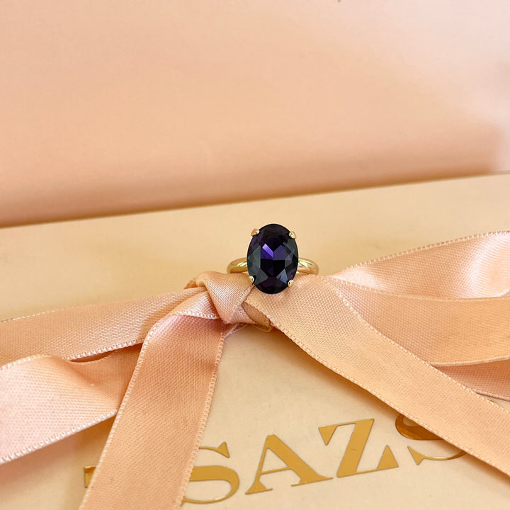 Dark purple oval preciosa crystals ring