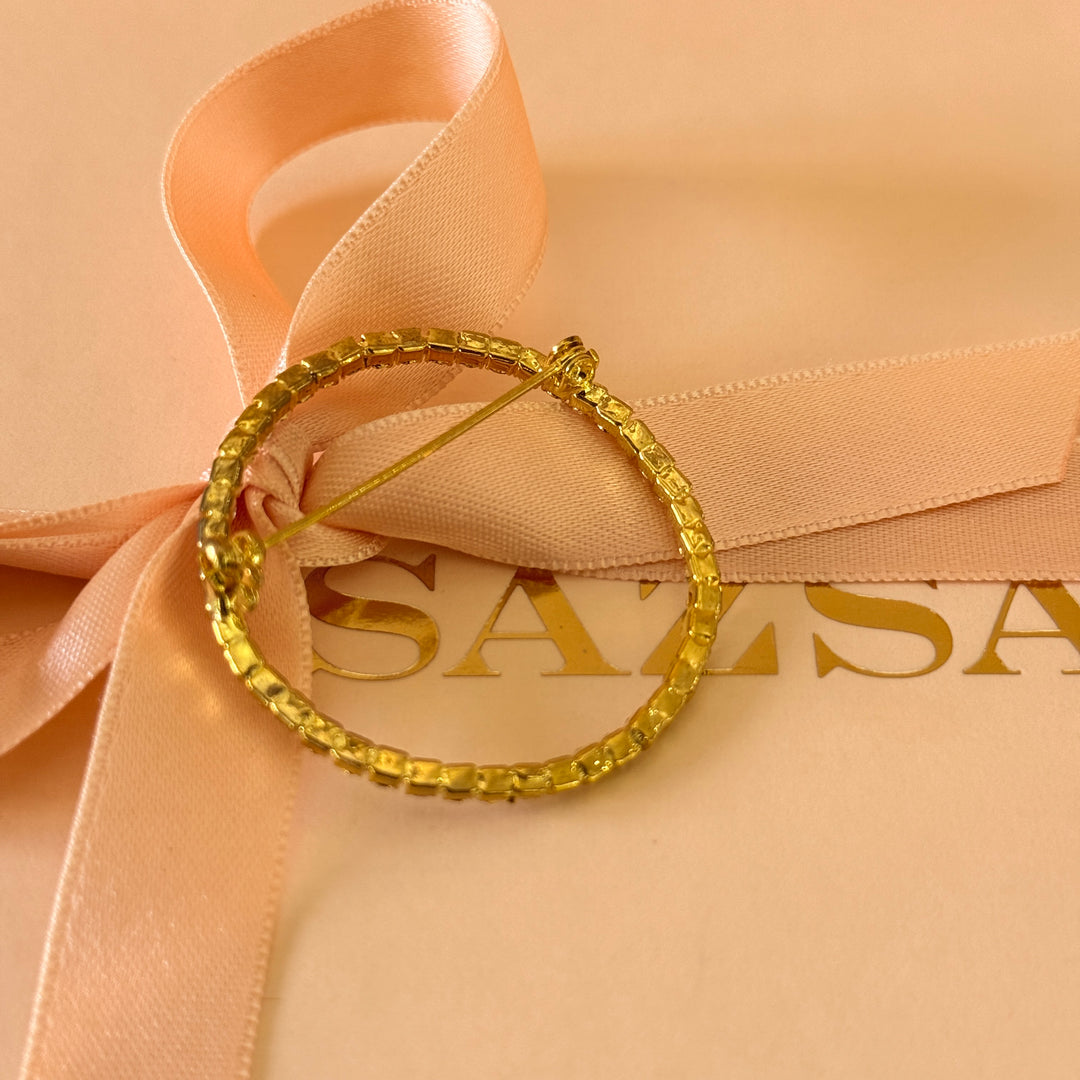 Round rhinestone gold plated brooch