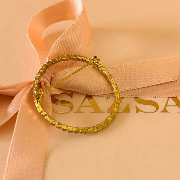Round rhinestone gold plated brooch