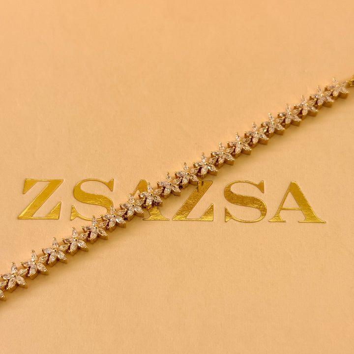 Dainty flowers zircone gold plated earrings and bracelet