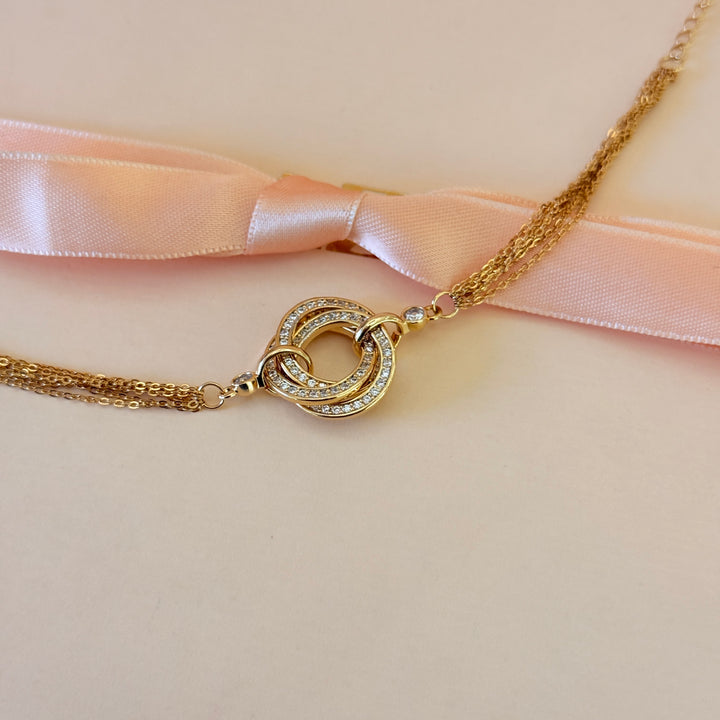 Zircone twisted round in the middle gold plated bracelet