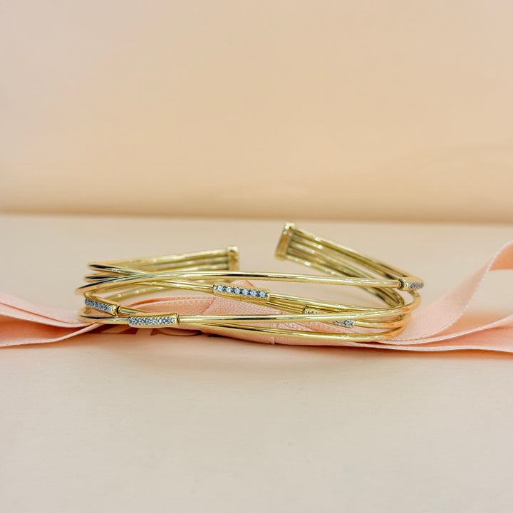 Zircone crossed gold plated sterling silver bangle