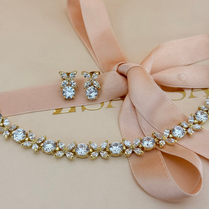 Round and marquise zircone gold plated earrings and bracelet