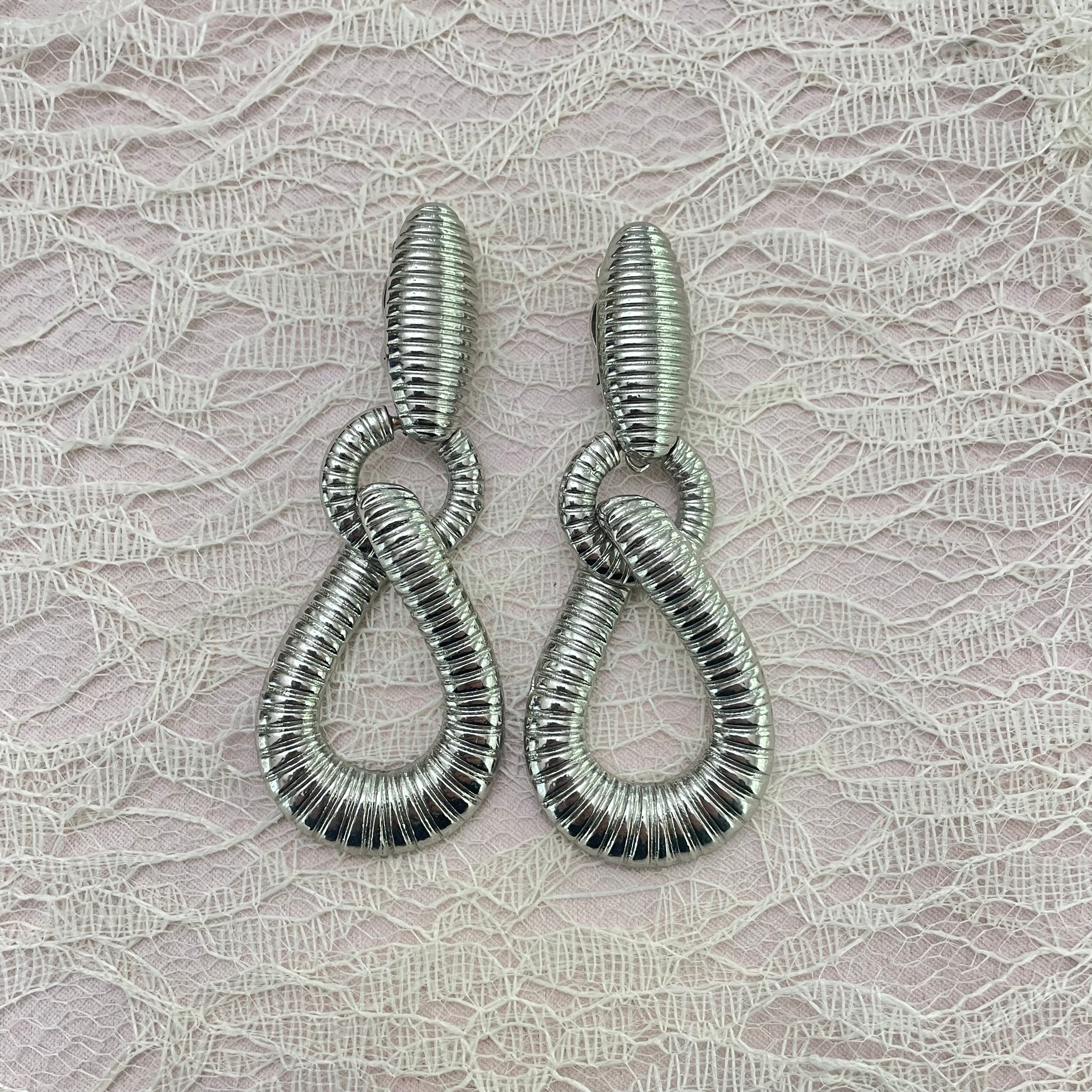 Long silver clips earrings