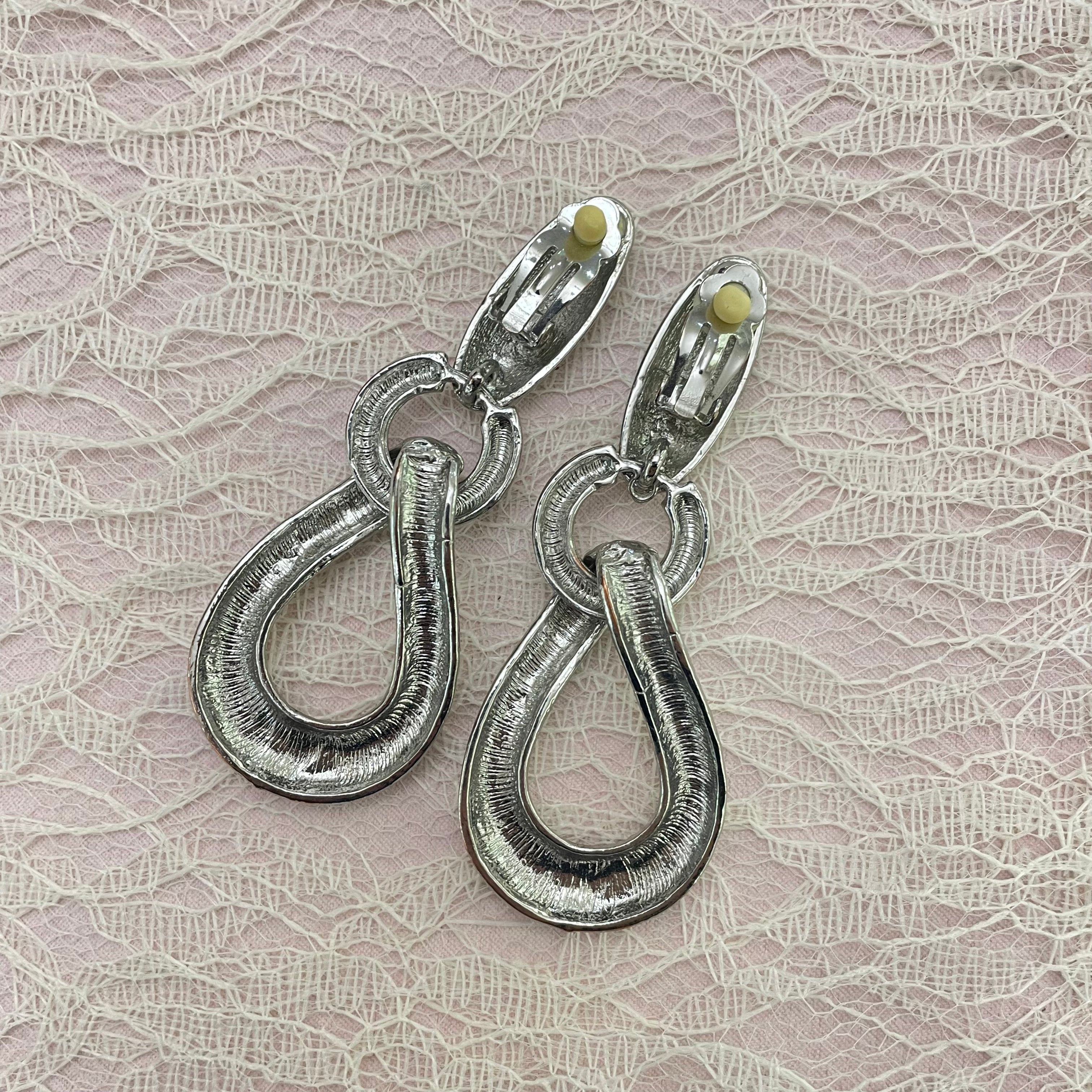 Long silver clips earrings