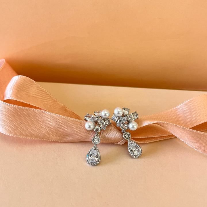 Teardrop zicone and white pearls white gold plated earrings