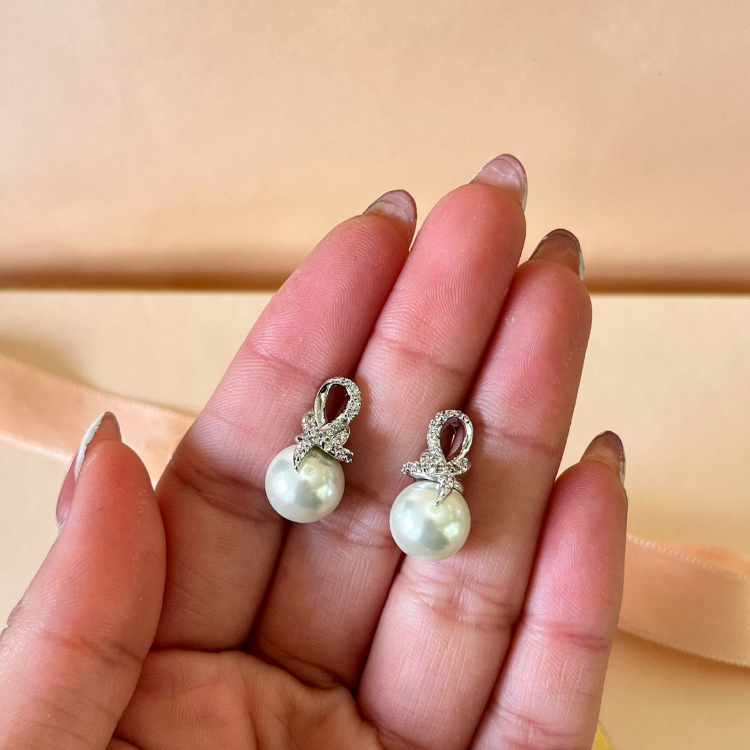 Zircone and white pearls white gold plated studs