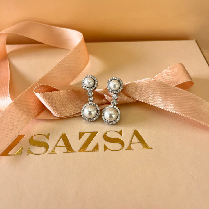 Zircone and white pearls white gold plated round set
