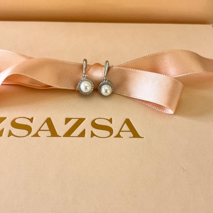 Zircone and white pearls sterling silver round set