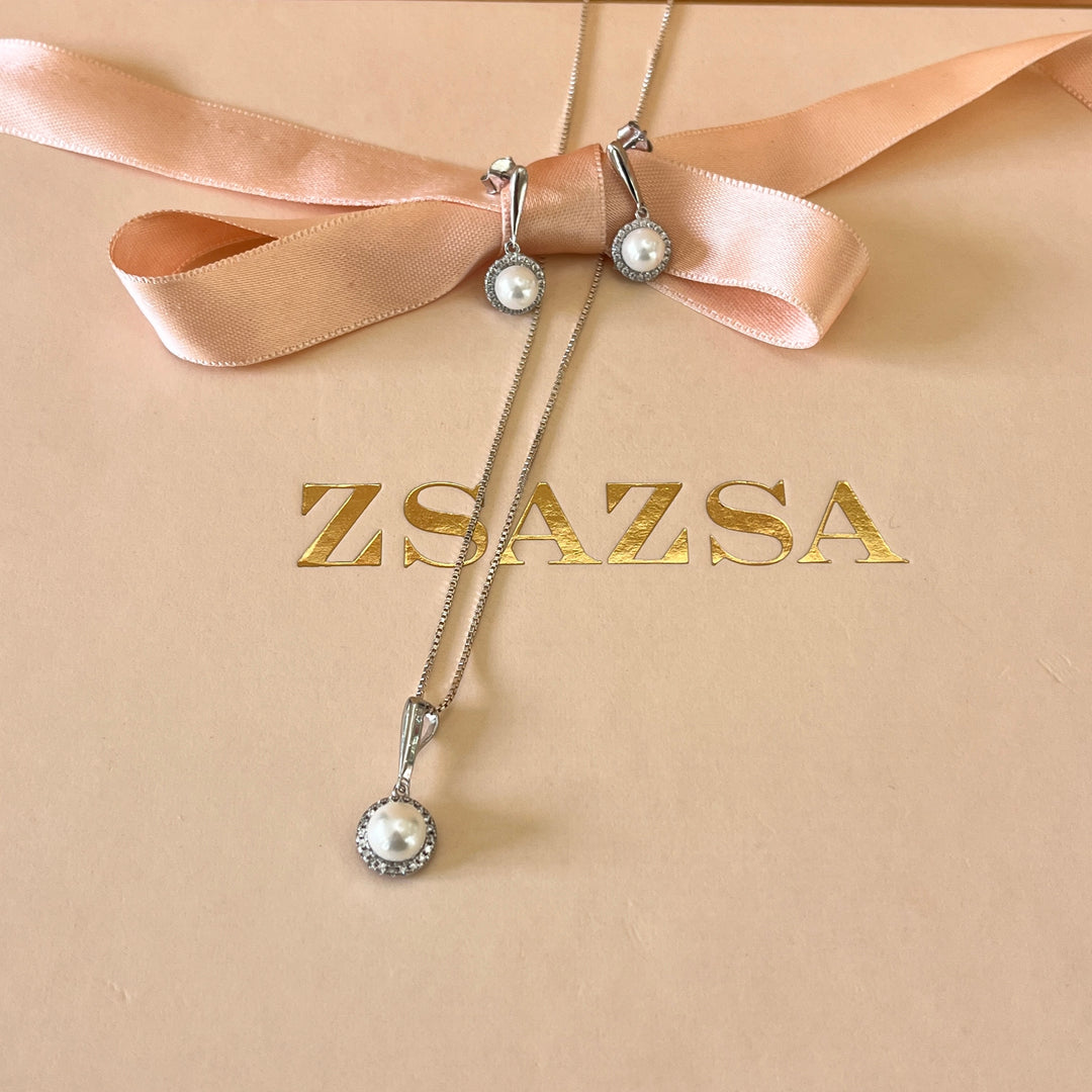 Zircone and white pearls sterling silver round set