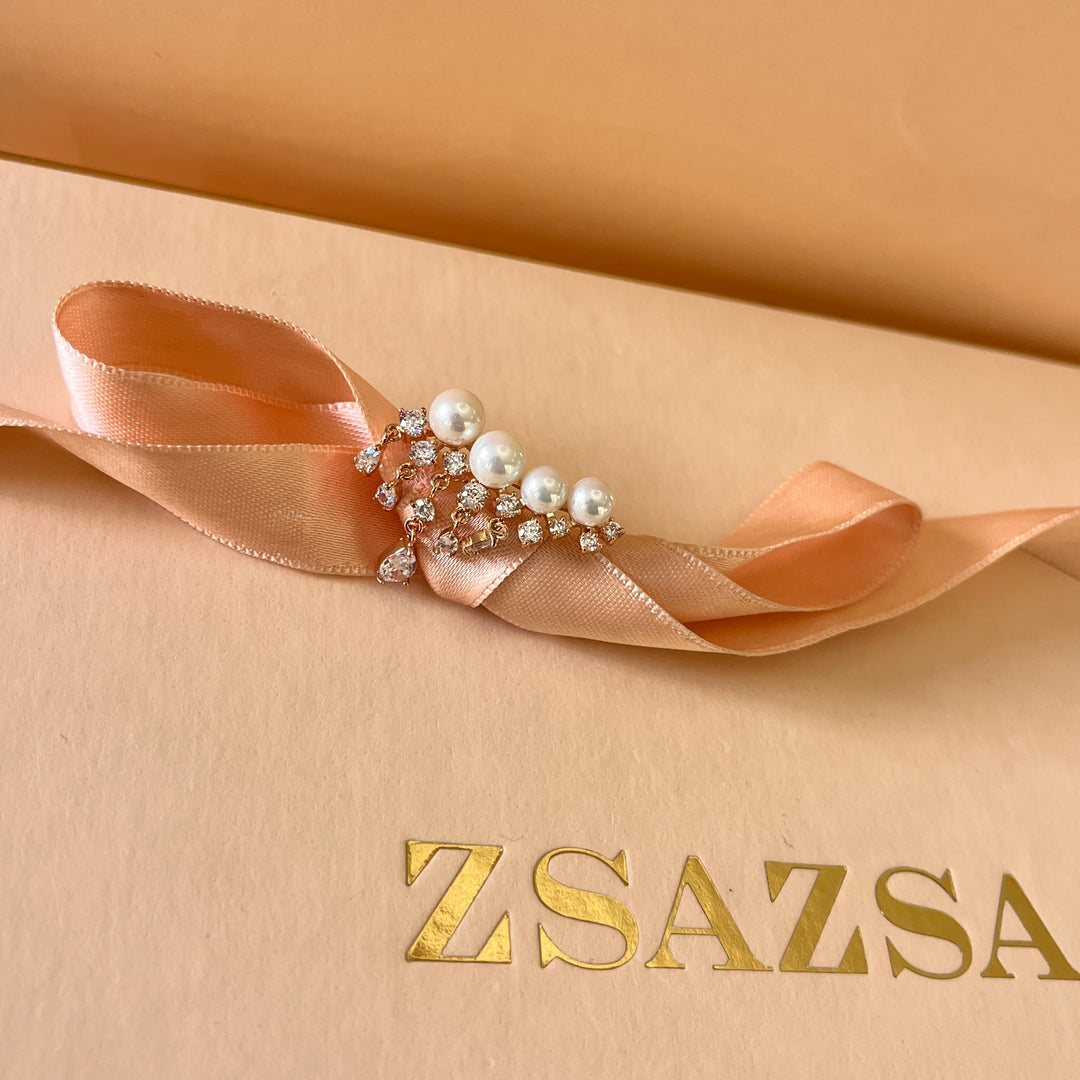 Teardrop zircone and white pearls rose gold plated asymmetrical earrings