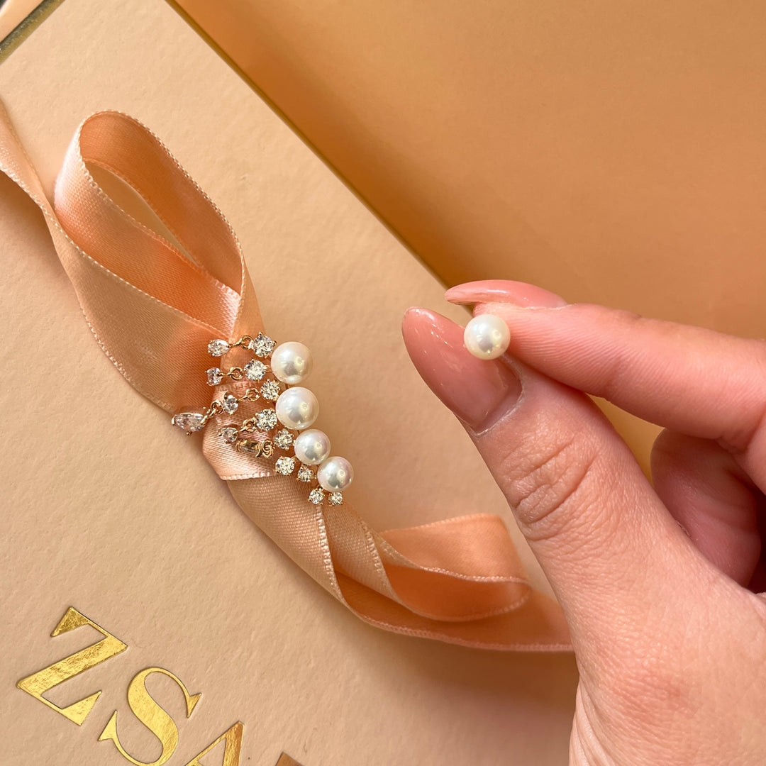 Teardrop zircone and white pearls rose gold plated asymmetrical earrings