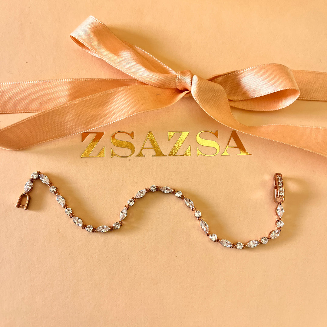 Teardrop and marquise zircone rose gold plated earrings and bracelet