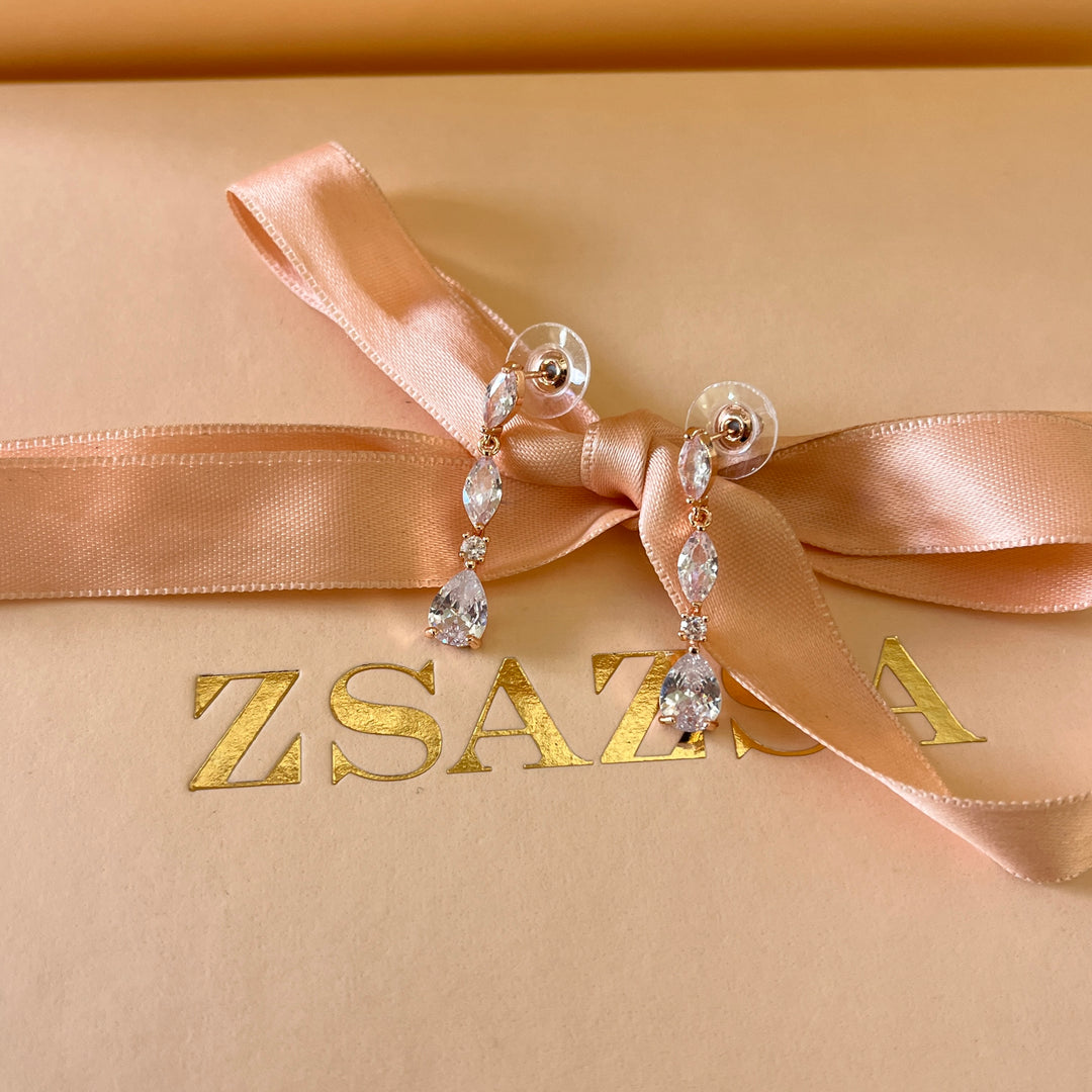 Teardrop and marquise zircone rose gold plated earrings and bracelet