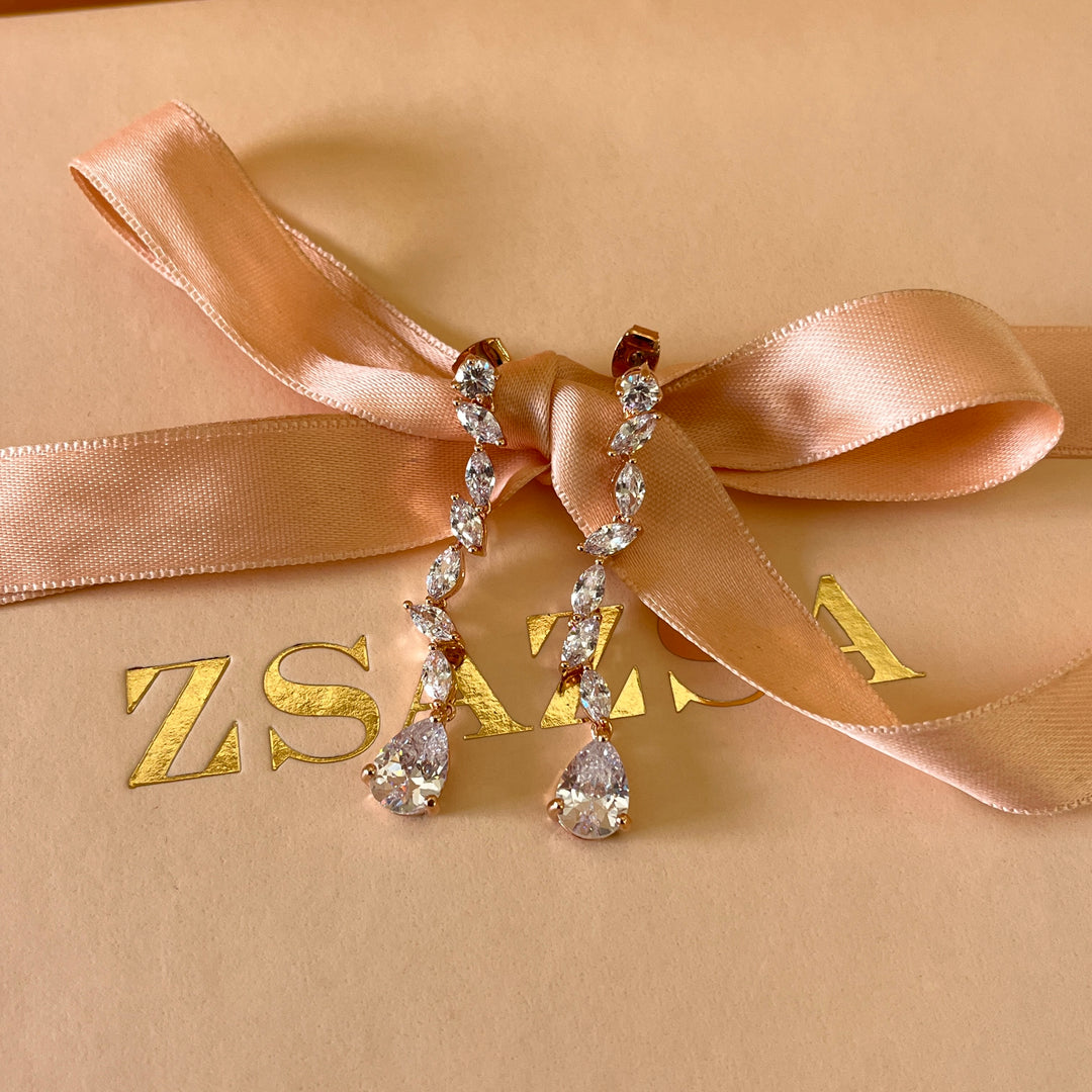 Teardrop and marquise zircone rose gold plated earrings and bracelet