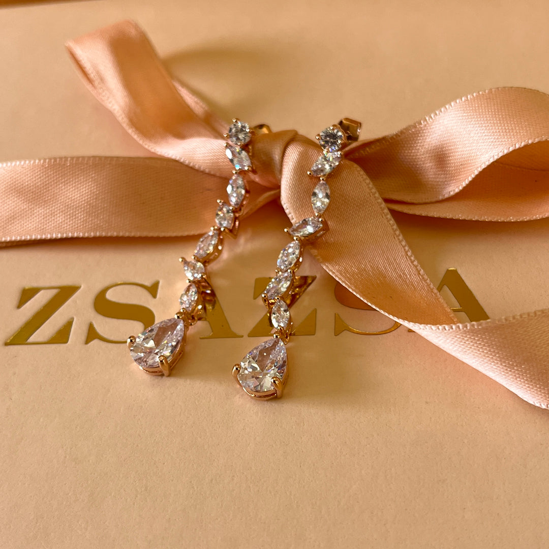 Teardrop and marquise zircone rose gold plated earrings and bracelet