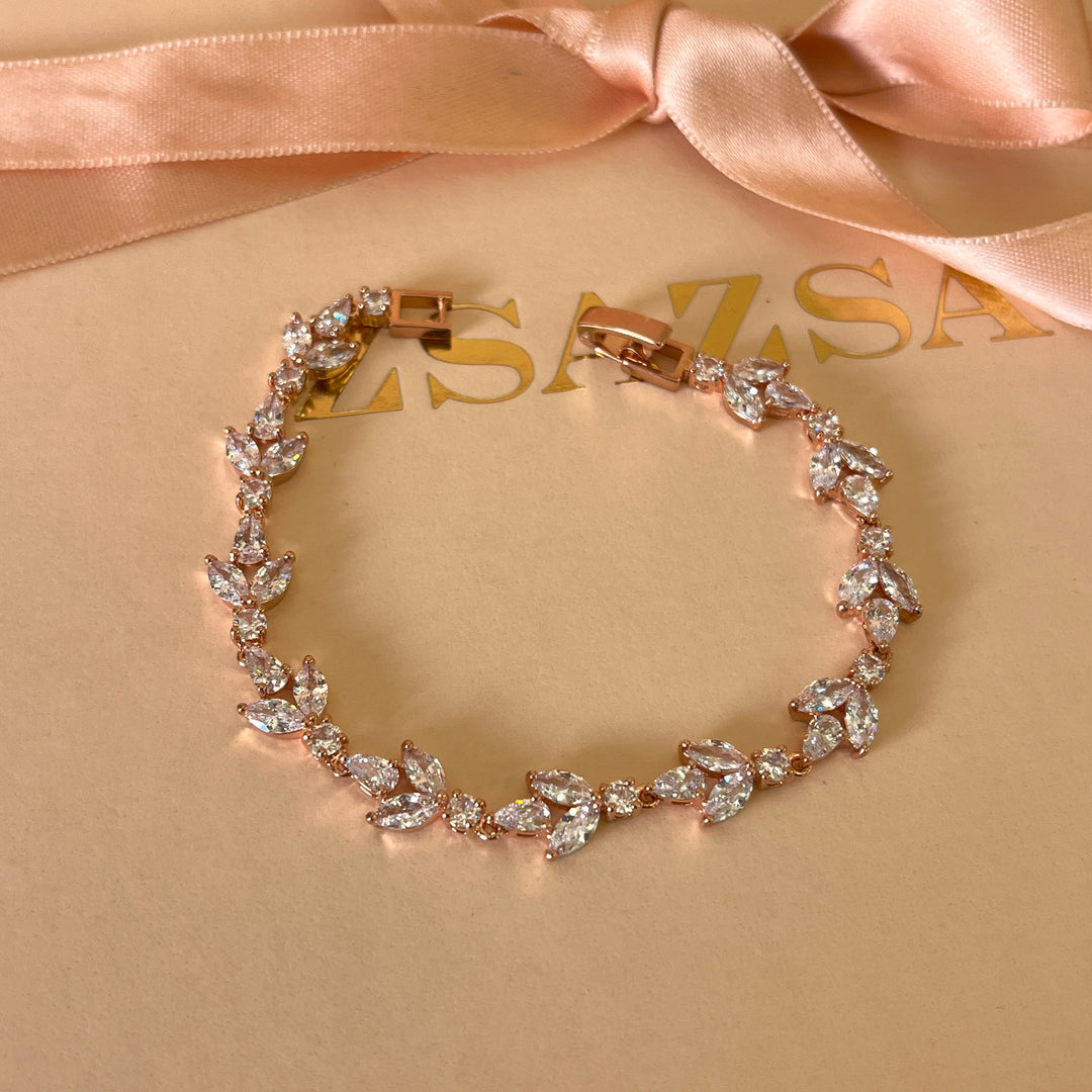 Teardrop and round zircone rose gold plated earrings and bracelet