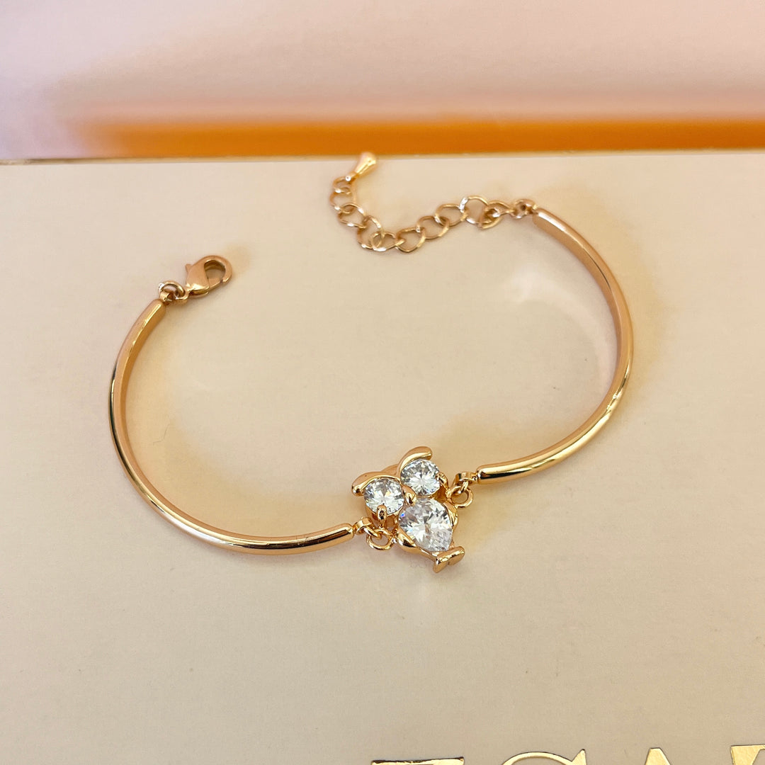 Zircone light rose gold plated owl bangle