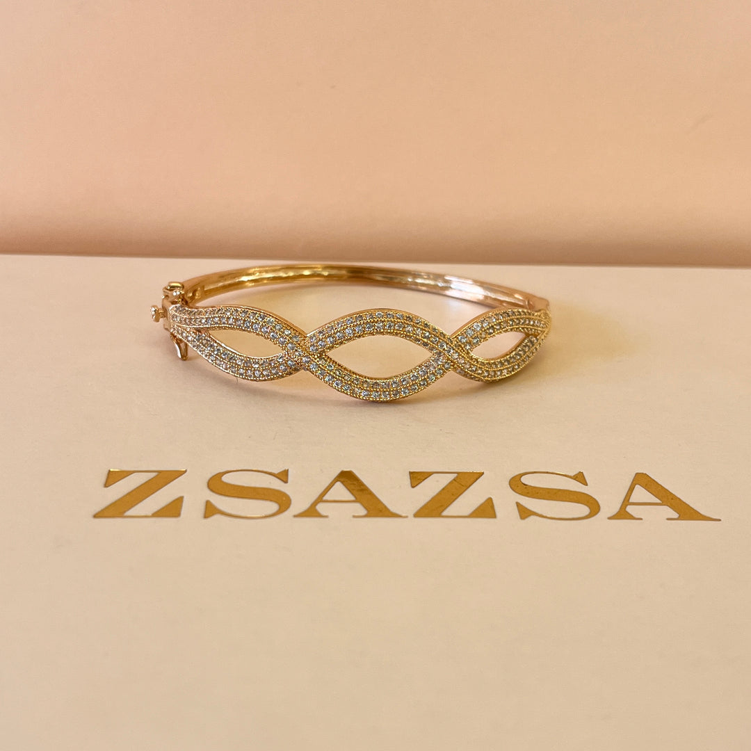 Zircone light rose gold plated twisted bangle
