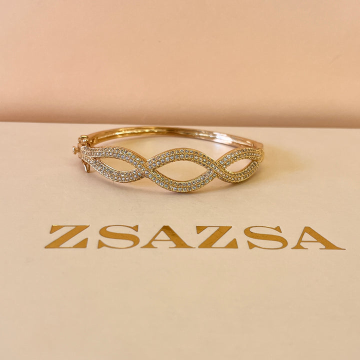 Zircone light rose gold plated twisted bangle
