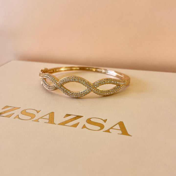 Zircone light rose gold plated twisted bangle