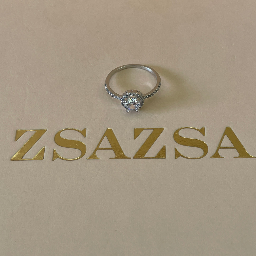 Zircone solitaire with small crystals ring in white gold plating