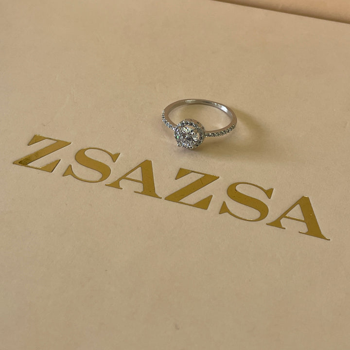 Zircone solitaire with small crystals ring in white gold plating