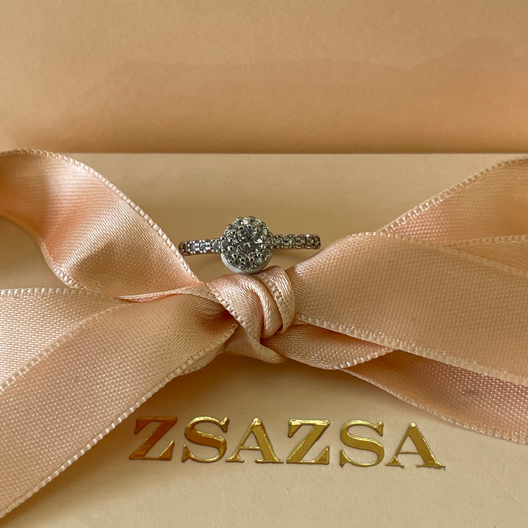 Zircone flower solitaire with small crystals ring in white gold plating