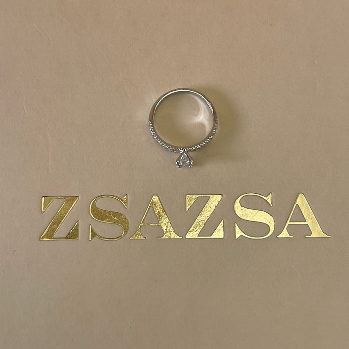 Zircone dainty solitaire with small crystals ring in white gold plating
