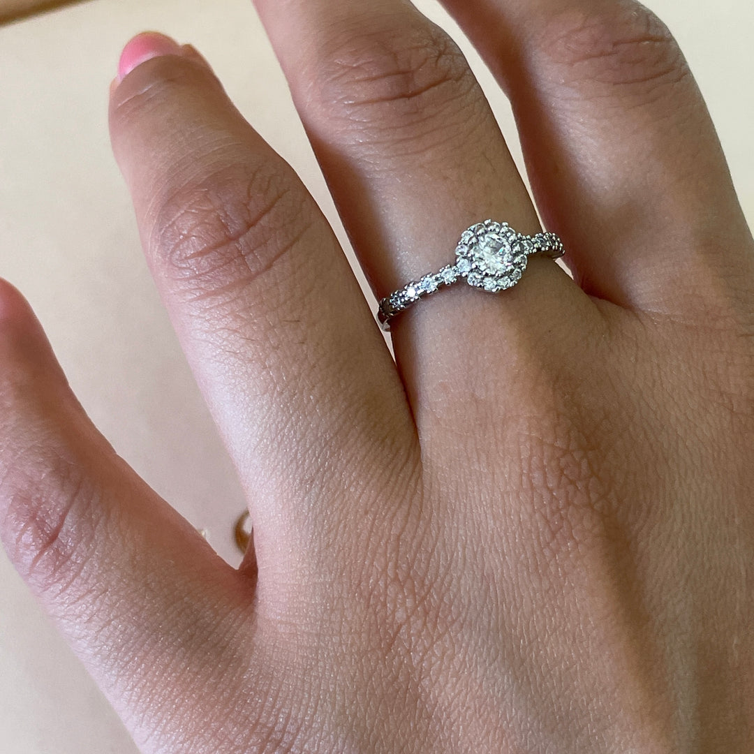 Zircone flower solitaire with small crystals ring in white gold plating