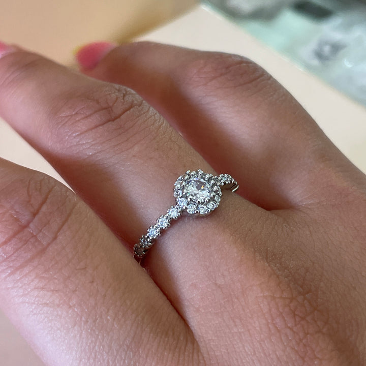 Zircone flower solitaire with small crystals ring in white gold plating