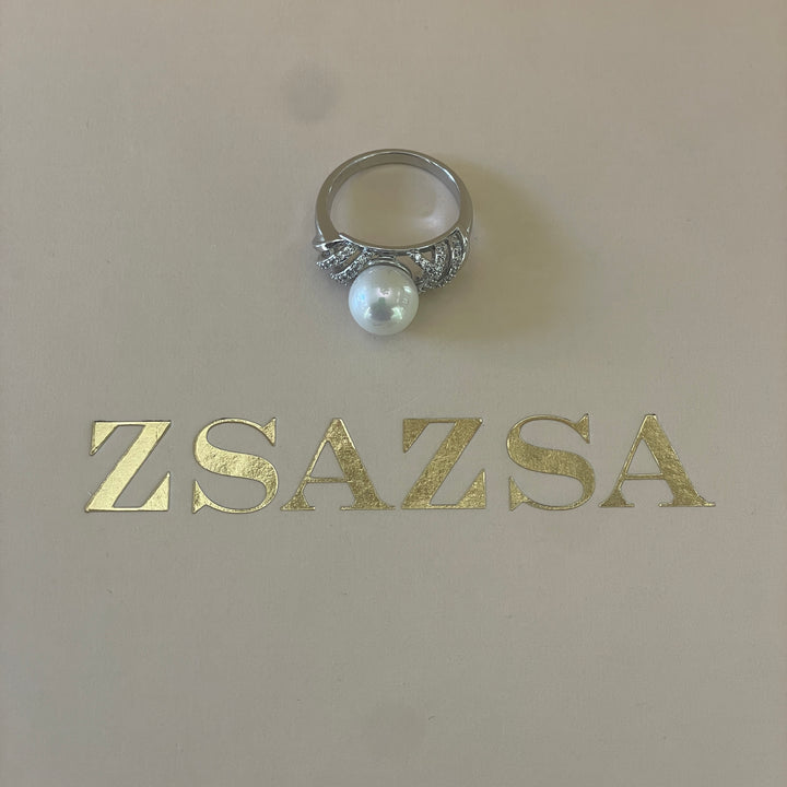 Silver crossed design with zircon and pearl ring in white gold plating