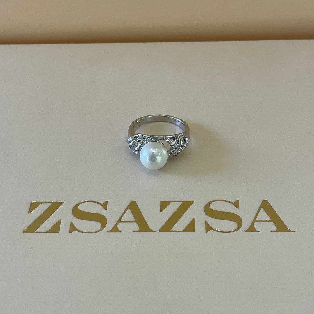 Silver crossed design with zircon and pearl ring in white gold plating