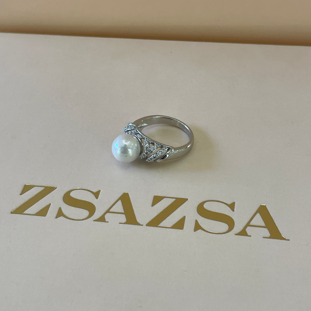 Silver crossed design with zircon and pearl ring in white gold plating