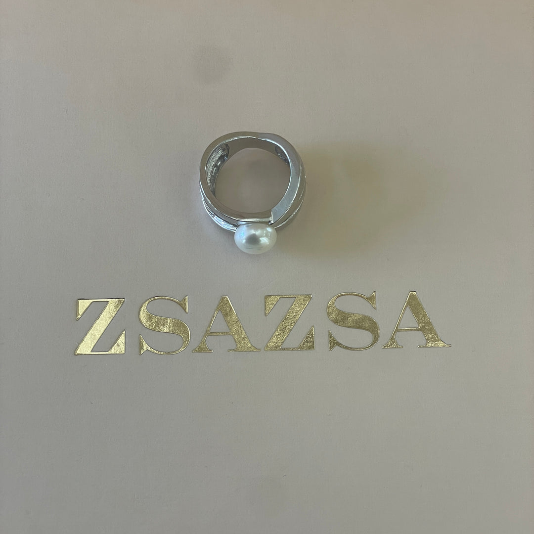 Silver crossed design with a dainty pearl ring in white gold plating