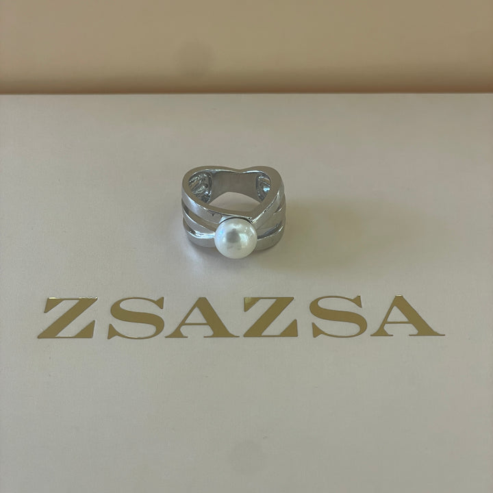 Silver crossed design with a dainty pearl ring in white gold plating